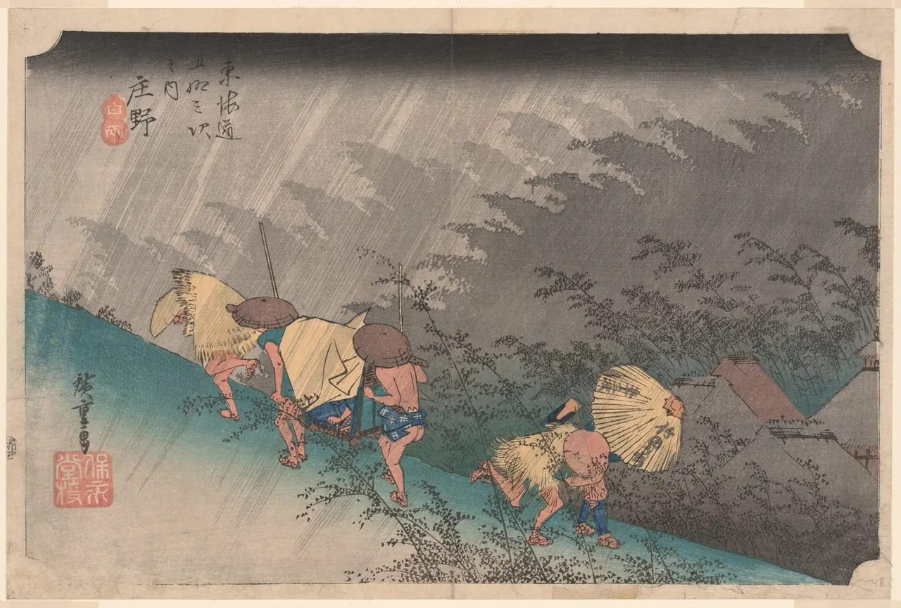 Porters and travellers run up a slope in driving rain, bent under straw capes and a palanquin, while bamboo bends in grey silhouette behind them.
