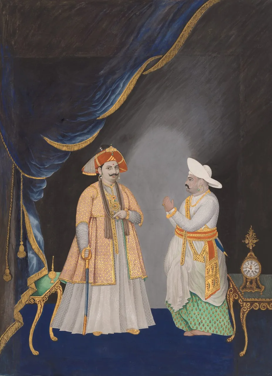 A Thanjavur painting of Maharaja Serfoji II and his minister standing side by side in white robes and turbans, with raised gold details.