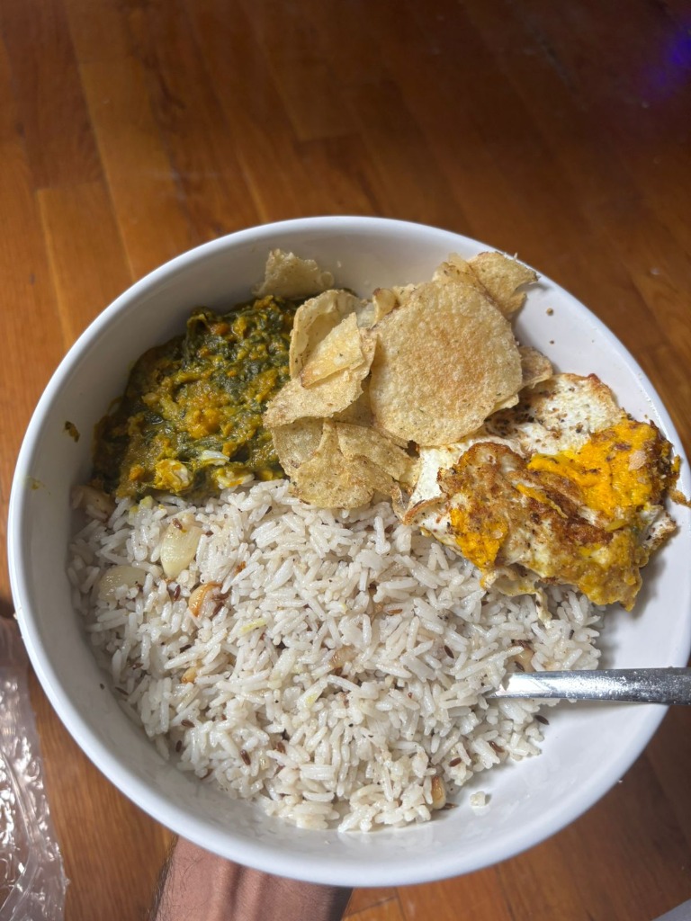 Homemade rice bowl with dal and papad